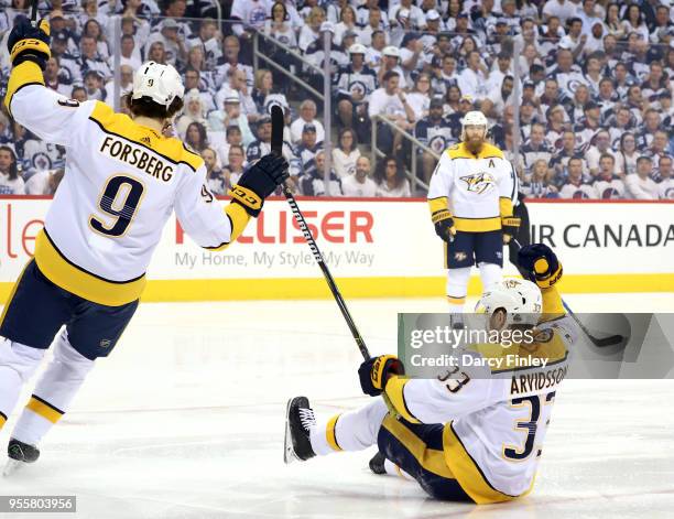 Filip Forsberg and Viktor Arvidsson of the Nashville Predators celebrate a first period goal against the Winnipeg Jets in Game Six of the Western...