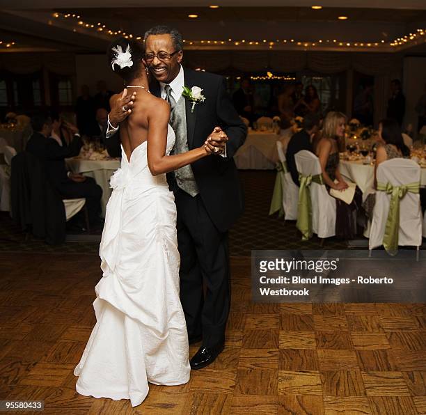 african bride and father dancing at wedding reception - reston stock pictures, royalty-free photos & images