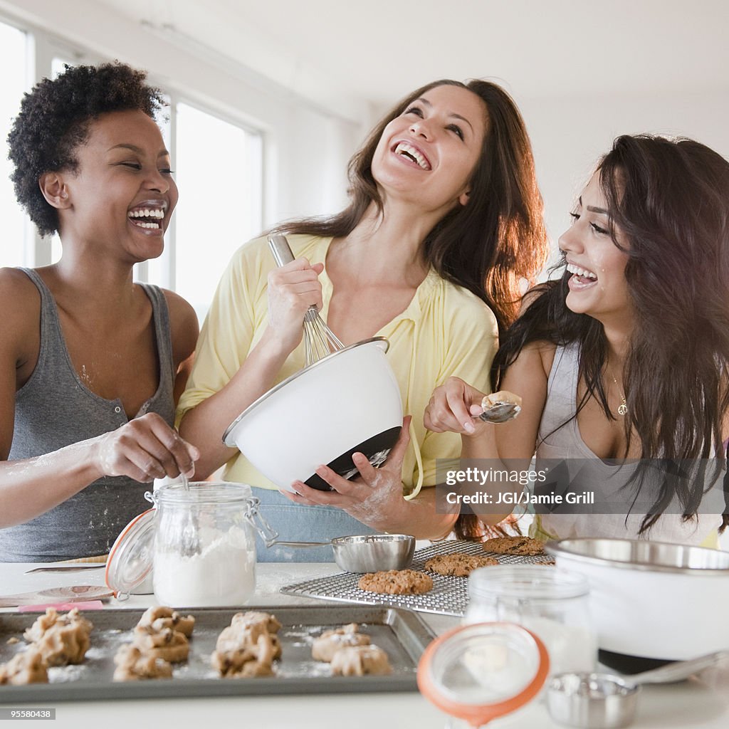 Friends making cookies together