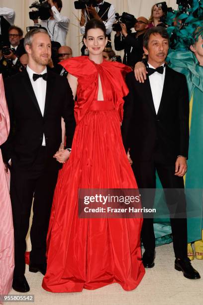 Adam Shulman, Anne Hathaway and Pierpaolo Piccioli attend the Heavenly Bodies: Fashion & The Catholic Imagination Costume Institute Gala at The...