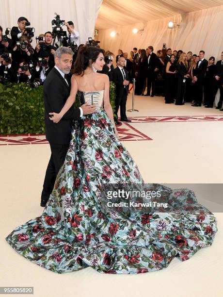 George and Amal Clooney attend 'Heavenly Bodies: Fashion & The Catholic Imagination' Costume Institute Gala at the Metropolitan Museum of Art on May...