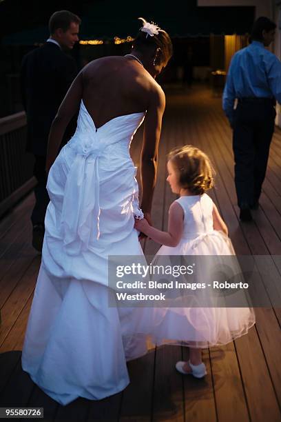 bride and flower girl holding hands - reston stock pictures, royalty-free photos & images