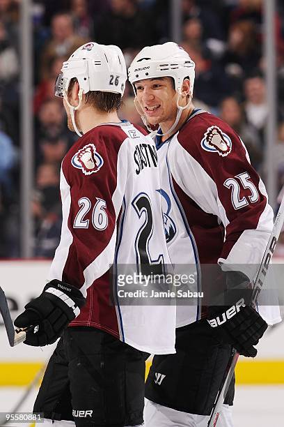 Forward Chris Stewart of the Colorado Avalanche talks with forward Paul Stastny of the Colorado Avalanche before a face off against the Columbus Blue...