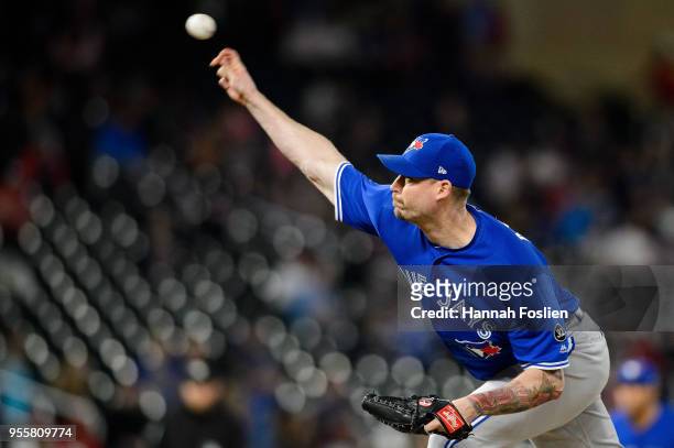 John Axford of the Toronto Blue Jays delivers a pitch against the Minnesota Twins during the game on May 1, 2018 at Target Field in Minneapolis,...