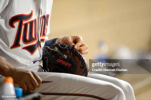 Jason Castro of the Minnesota Twins fixes a glove during the game against the Toronto Blue Jays on May 1, 2018 at Target Field in Minneapolis,...