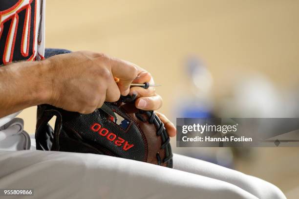 Jason Castro of the Minnesota Twins fixes a glove during the game against the Toronto Blue Jays on May 1, 2018 at Target Field in Minneapolis,...