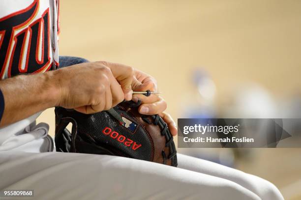 Jason Castro of the Minnesota Twins fixes a glove during the game against the Toronto Blue Jays on May 1, 2018 at Target Field in Minneapolis,...