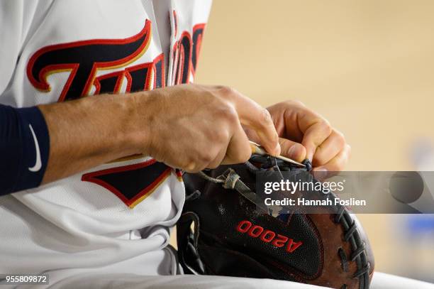 Jason Castro of the Minnesota Twins fixes a glove during the game against the Toronto Blue Jays on May 1, 2018 at Target Field in Minneapolis,...