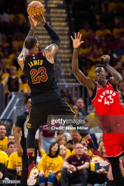 LeBron James of the Cleveland Cavaliers shoots over Pascal Siakam of the Toronto Raptors during the second half of Game 4 of the second round of the...