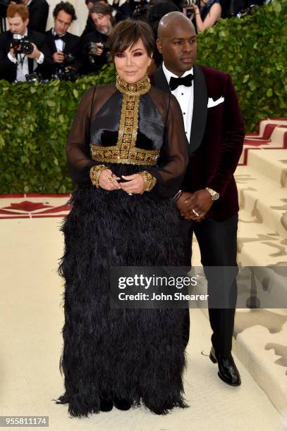 Kris Jenner and Corey Gamble attend the Heavenly Bodies: Fashion & The Catholic Imagination Costume Institute Gala at The Metropolitan Museum of Art...