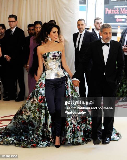 George Clooney and Amal Clooney attends Heavenly Bodies: Fashion & The Catholic Imagination Costume Institute Gala a the Metropolitan Museum of Art...