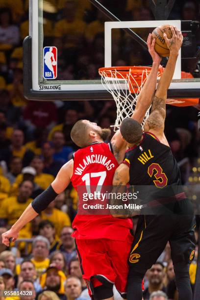 Jonas Valanciunas of the Toronto Raptors blocks George Hill of the Cleveland Cavaliers during the second half of Game 4 of the second round of the...