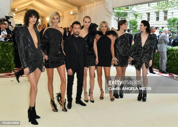 Mica Arganaraz, Anja Rubik, Anthony Vaccarello, Amber Valletta, Kate Moss, Charlotte Casiraghi and Charlotte Gainsbourg arrive for the 2018 Met Gala...