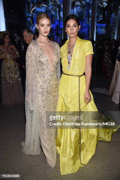 Rosie Huntington-Whiteley and Lily Aldridge attend the Heavenly Bodies: Fashion & The Catholic Imagination Costume Institute Gala at The Metropolitan...