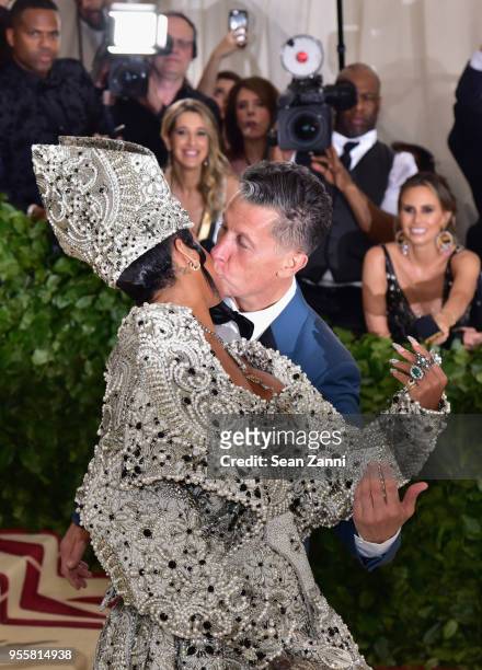 Rihanna and Stefano Tonchi attend the Heavenly Bodies: Fashion & The Catholic Imagination Costume Institute Gala at The Metropolitan Museum of Art on...