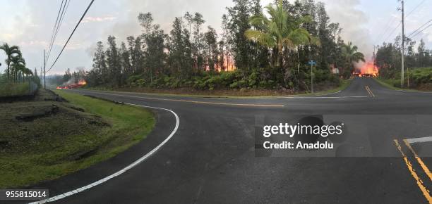 Lava flows from the crater of Kilauea volcano as dozens of structures, including at least nine homes, have been destroyed by scorching lava flows...