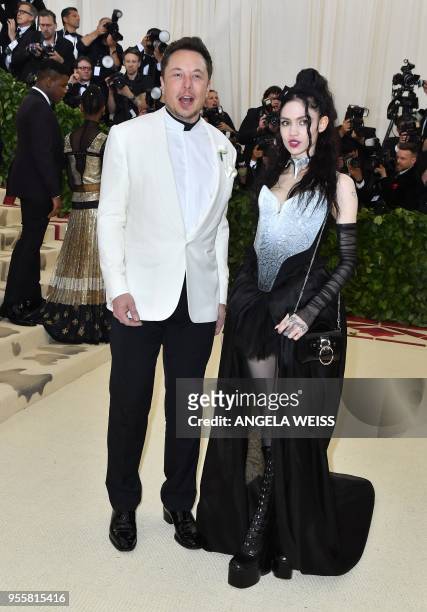 Elon Musk and Grimes arrive for the 2018 Met Gala on May 7 at the Metropolitan Museum of Art in New York. - The Gala raises money for the...