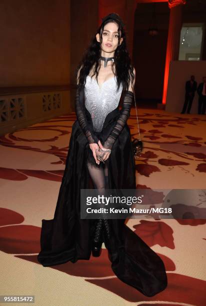 Grimes attends the Heavenly Bodies: Fashion & The Catholic Imagination Costume Institute Gala at The Metropolitan Museum of Art on May 7, 2018 in New...