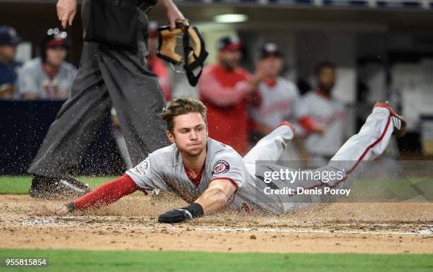 Trea Turner of the Washington Nationals slides as he scores during the sixth inning of a baseball game against the San Diego Padres at PETCO Park on...