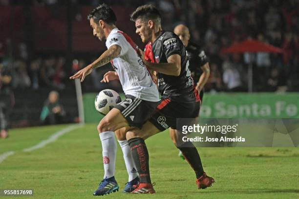 Ignacio Scocco of River Plate fights for the ball with Guillermo Ortiz of Colon during a match between Colon and River Plate as part of Superliga at...
