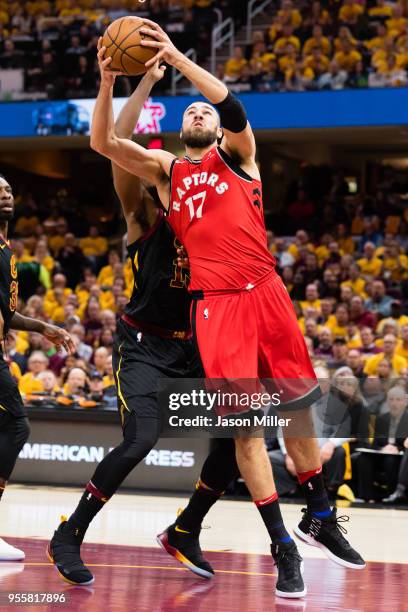 Jonas Valanciunas of the Toronto Raptors shoots over Tristan Thompson of the Cleveland Cavaliers during the first half of Game 4 of the second round...