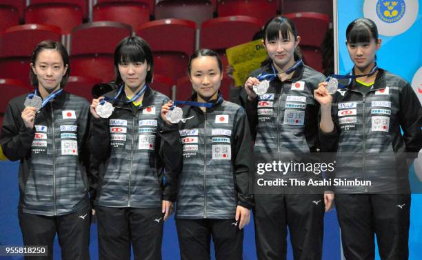 Silver medalists Kasumi Ishikawa, Miu Hirano, Mima Ito, Hina Hayata and Miyu Nagasaki of Japan pose for photographs during the medal ceremony for the...