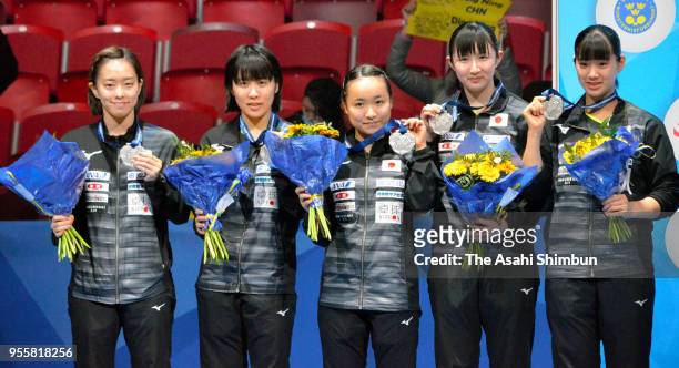 Silver medalists Kasumi Ishikawa, Miu Hirano, Mima Ito, Hina Hayata and Miyu Nagasaki of Japan pose for photographs during the medal ceremony for the...