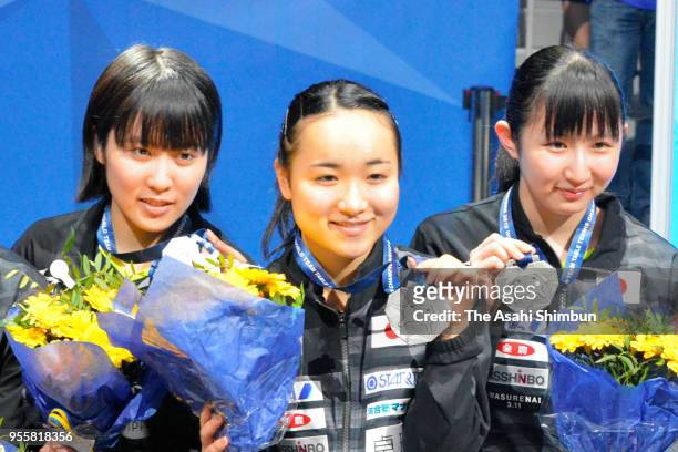 Silver medalists Miu Hirano, Mima Ito and Hina Hayata of Japan pose for photographs during the medal ceremony for the Women's event on day seven of...