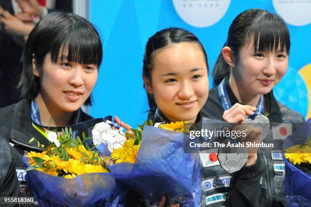 Silver medalists Miu Hirano, Mima Ito and Hina Hayata of Japan pose for photographs during the medal ceremony for the Women's event on day seven of...