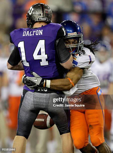 Kyle Wilson of the Boise State Broncos sacks quarterback Andy Dalton of the TCU Horned Frogs as Dalton looses the ball but it was recovered by a...