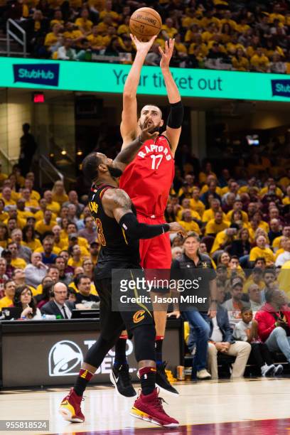 LeBron James of the Cleveland Cavaliers tries to block Jonas Valanciunas of the Toronto Raptors during the second half of Game 4 of the second round...