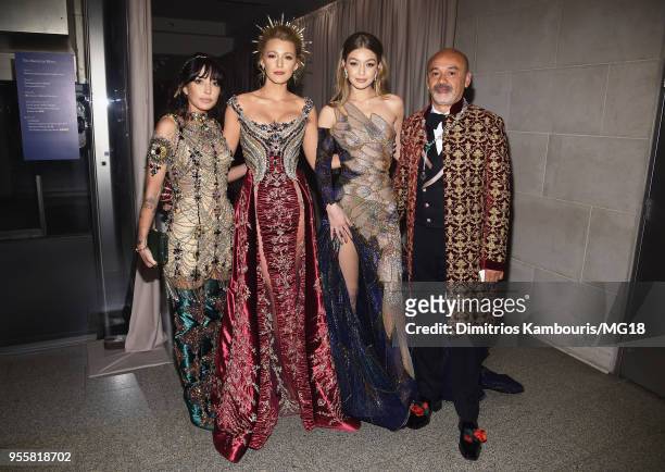 Blake Lively , Gigi Hadid and designer Christian Louboutin attend the Heavenly Bodies: Fashion & The Catholic Imagination Costume Institute Gala at...
