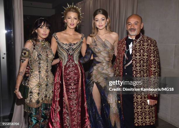 Blake Lively , Gigi Hadid and designer Christian Louboutin attend the Heavenly Bodies: Fashion & The Catholic Imagination Costume Institute Gala at...