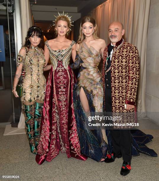 Blake Lively, Gigi Hadid and Christian Louboutin attend the Heavenly Bodies: Fashion & The Catholic Imagination Costume Institute Gala at The...