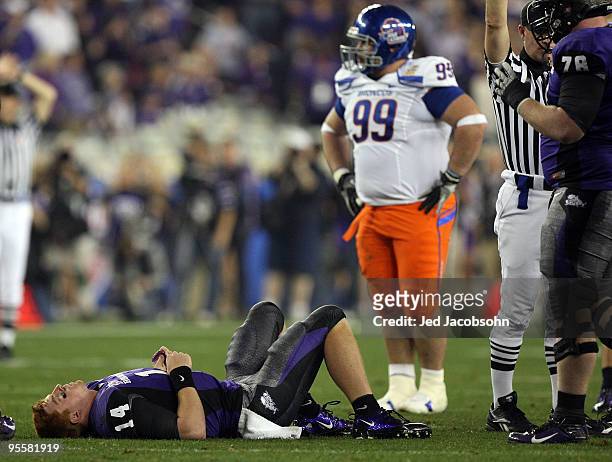 Quarterback Andy Dalton of the TCU Horned Frogs lays on the ground injured after getting sacked against the Boise State Broncos during the Tostitos...