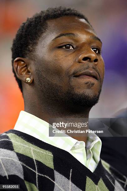 LaDainian Tomlinson, of the NFL's San Diego Chargers and a former TCU Horned Frog, watches the Tostitos Fiesta Bowl between the Boise State Broncos...