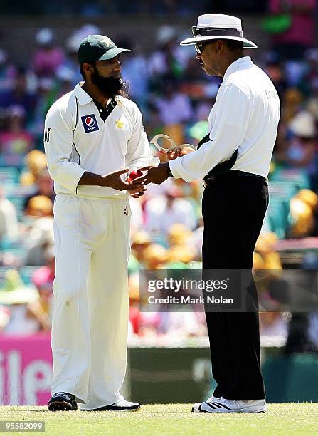 Pakistan captain Mohammad Yousuf approaches umpire Billy Doctrove about the shape of the ball during day three of the Second Test match between...