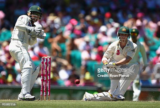 Phillip Hughes of Australia bats as Kamran Akmal of Pakistan keeps wicket during day three of the Second Test match between Australia and Pakistan at...
