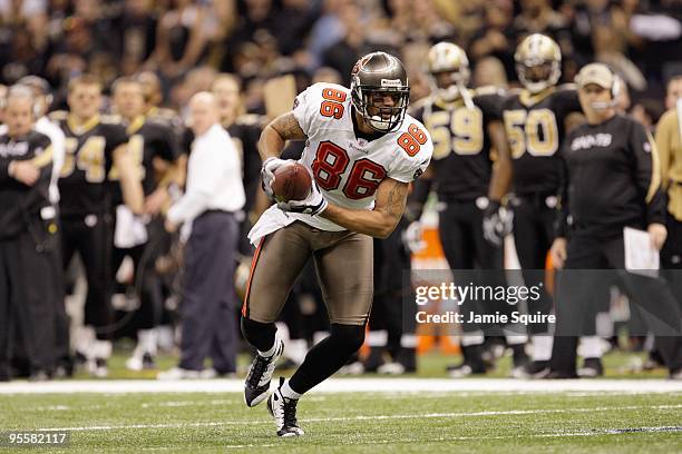 Jerramy Stevens of the Tampa Bay Buccaneers carries the ball during the game against the New Orleans Saints at the Louisiana Superdome on December...