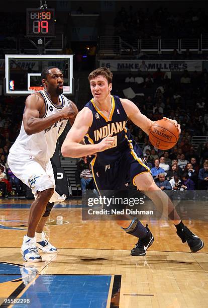 Tyler Hansbrough of the Indiana Pacers drives against Gilbert Arenas of the Washington Wizards during the game on December 12, 2009 at the Verizon...