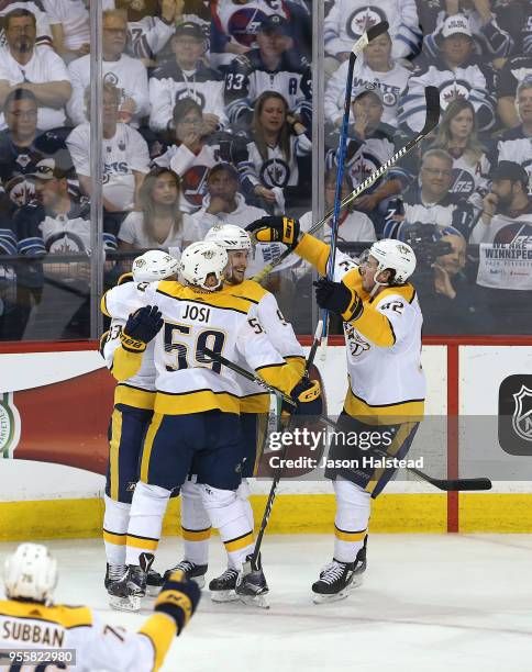 Roman Josi, Viktor Arvidsson and Ryan Johansen of the Nashville Predators congratulate teammate Filip Forsberg on his second goal against the...