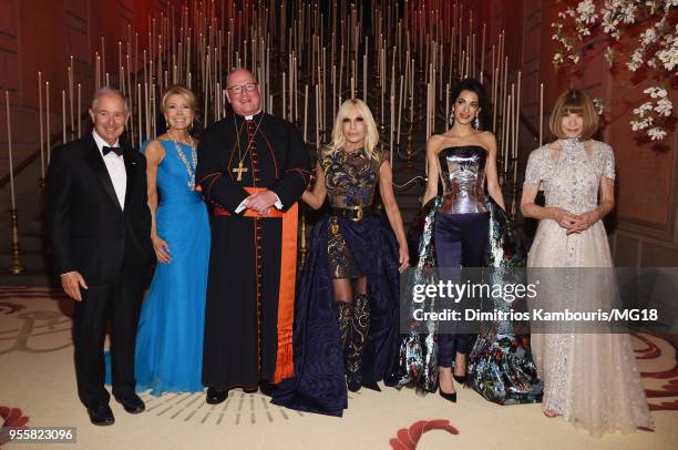 Stephen Schwarzman, Christine Schwarzman, Cardinal Timothy Michael Dolan, Donatella Versace, Amal Clooney and Anna Wintour attend the Heavenly...