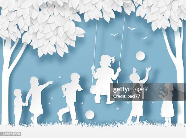 silhouette of happy children playing. paper cut style - papercutting stock illustrations
