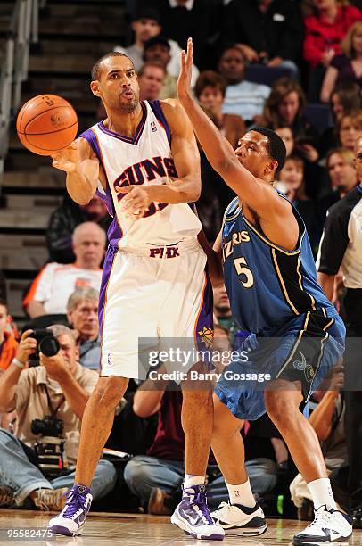Grant Hill of the Phoenix Suns passes against Dominic McGuire of the Washington Wizards during the game on December 19, 2009 at U.S. Airways Center...
