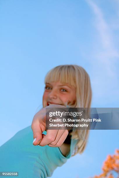 smiling girl pointing finger at camera - wonky fringe stock pictures, royalty-free photos & images
