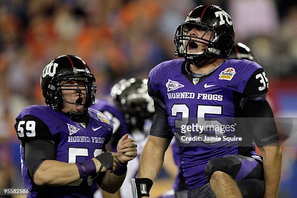 Tanner Brock and Logan Sligar of the TCU Horned Frogs react after making a tackle in the first half against the Boise State Broncos during the...