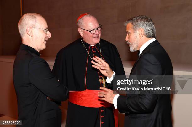 Fr. James Martin, Timothy Cardinal Dolan, George Clooney attends the Heavenly Bodies: Fashion & The Catholic Imagination Costume Institute Gala at...