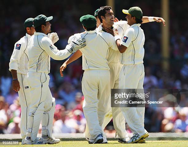 Umar Gul of Pakistan celebrates with team mates after dismissing Shane Watson of Australia for 97 runs during day three of the Second Test match...