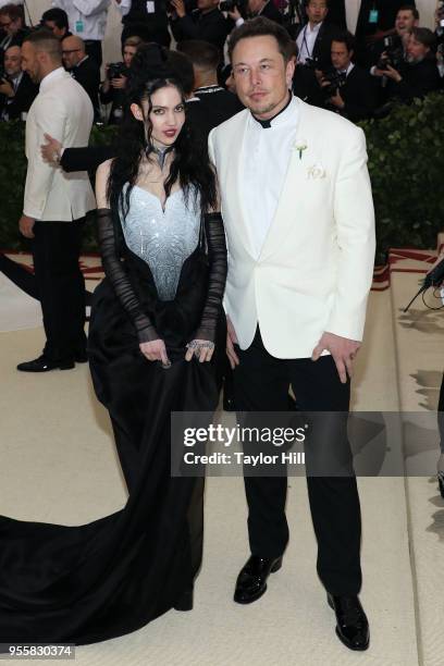 Grimes and Elon Musk attend "Heavenly Bodies: Fashion & the Catholic Imagination", the 2018 Costume Institute Benefit at Metropolitan Museum of Art...