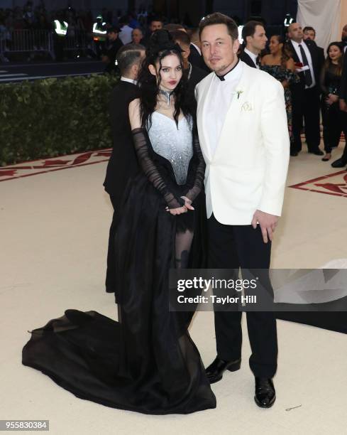 Grimes and Elon Musk attend "Heavenly Bodies: Fashion & the Catholic Imagination", the 2018 Costume Institute Benefit at Metropolitan Museum of Art...